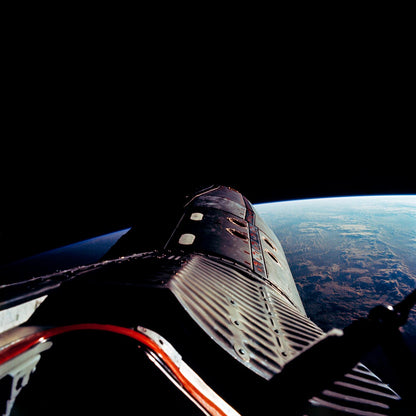 The Gemini-12 spacecraft during standup extravehicular activity with the hatch open by NASA