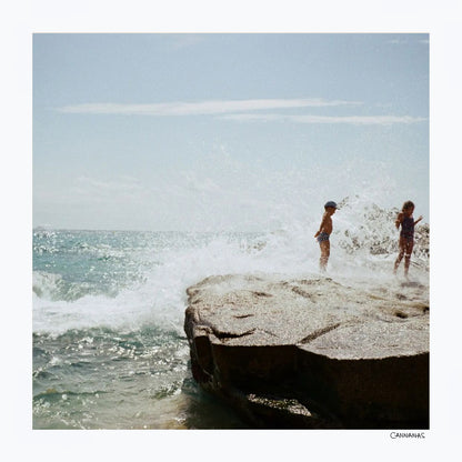 Children playing on the beach by Cannanas